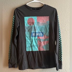 Long sleeve shirt with Be wild graphic, including checkered graphics on sleeves
